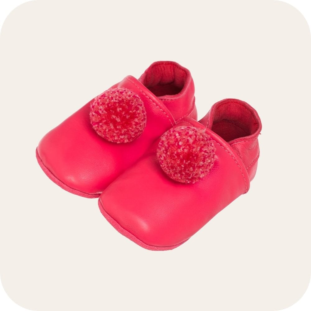 Chaussons bébé à pompons – Fuchsia